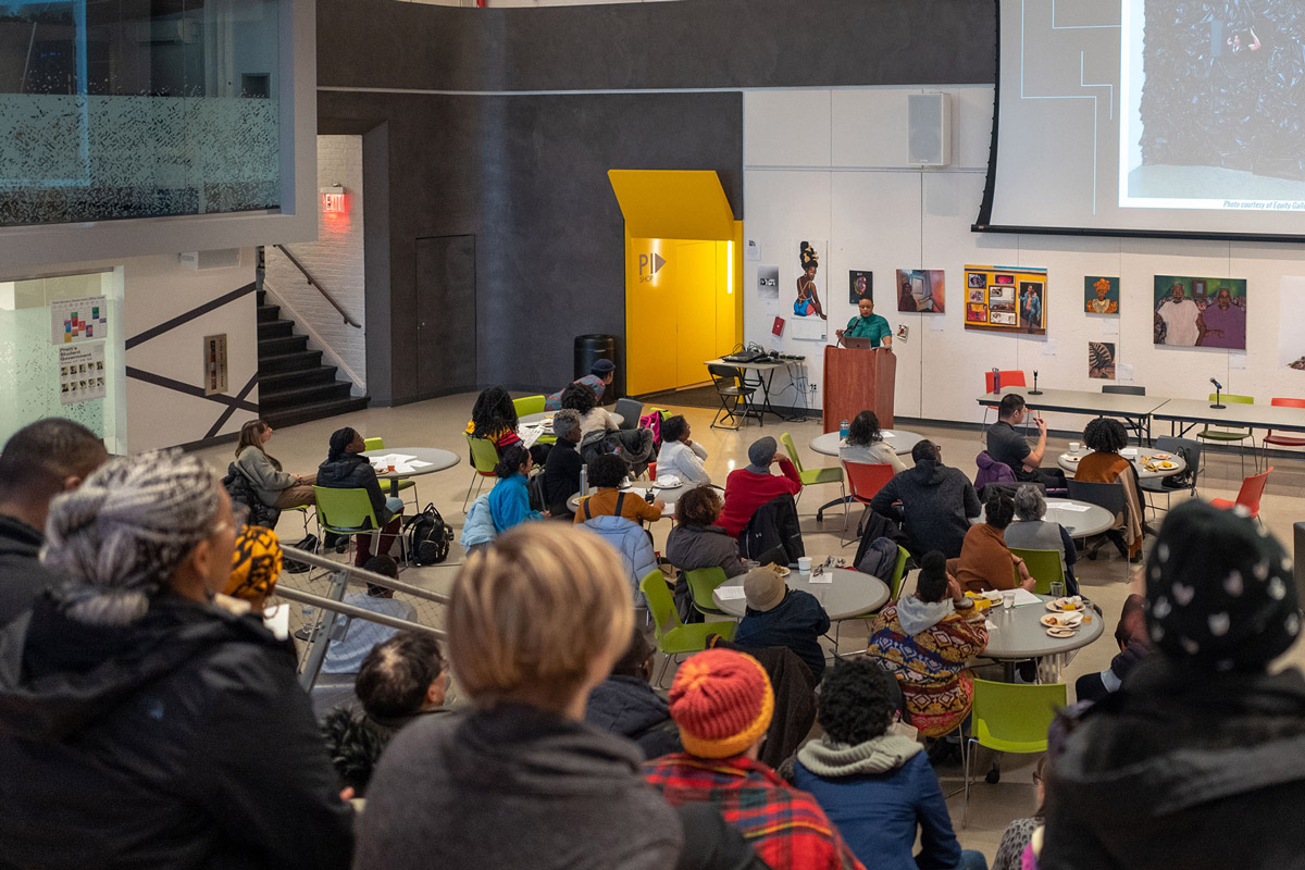 Artist Taja Lindley speaking on “Re-Membering is the Responsibility of the Living” at the Teach-In (photo by Armon Burton)